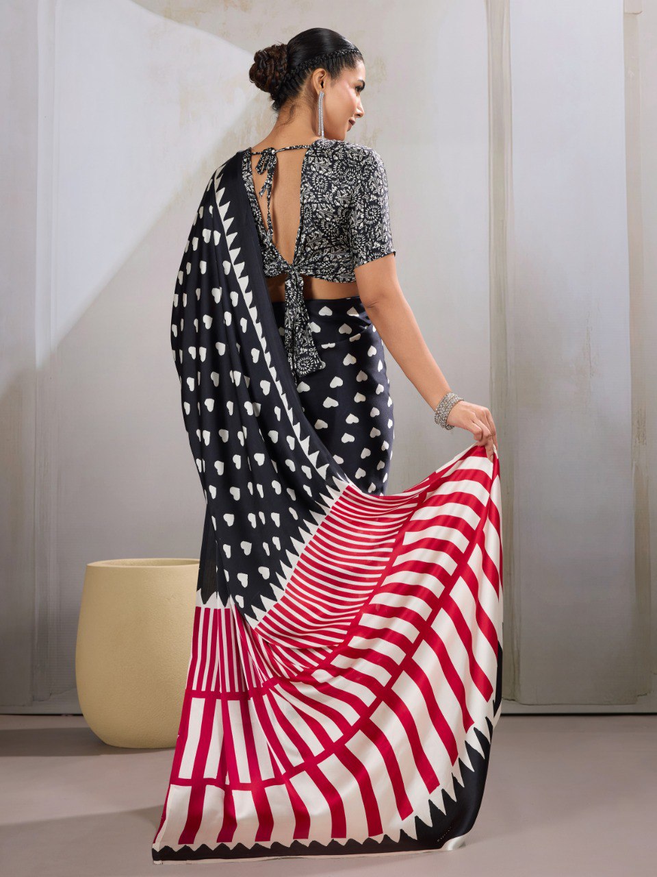 Pure Ajrakh modal satin fabric featuring traditional printed motifs with rich, earthy tones and a soft, breathable feel, perfect for all-day elegance.