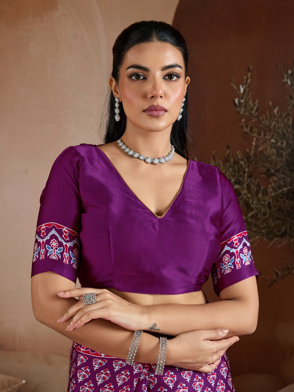 Pure Ajrakh modal satin fabric featuring traditional printed motifs with rich, earthy tones and a soft, breathable feel, perfect for all-day elegance.