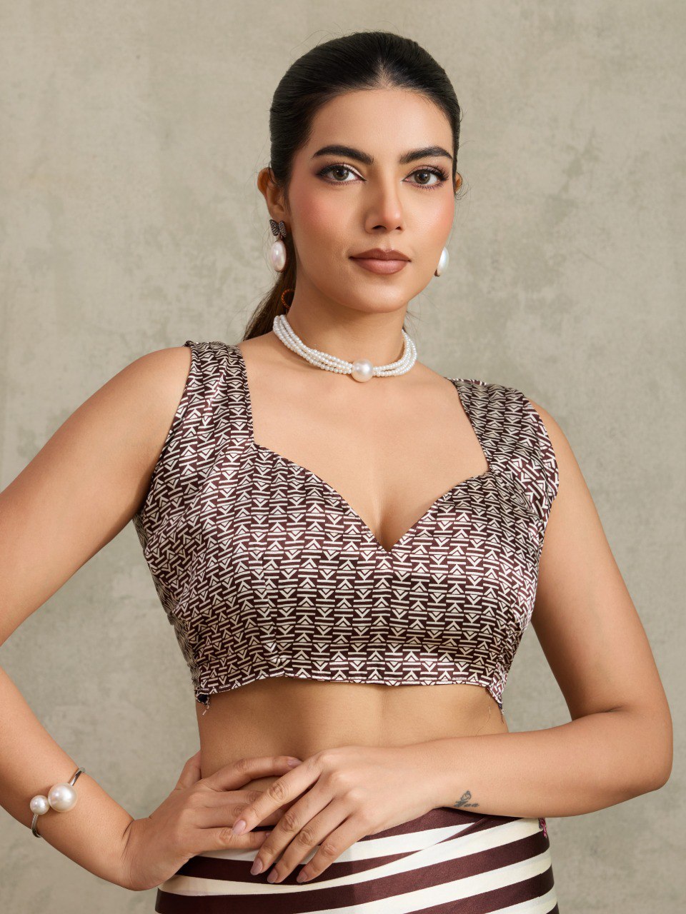 Pure Ajrakh modal satin fabric featuring traditional printed motifs with rich, earthy tones and a soft, breathable feel, perfect for all-day elegance.