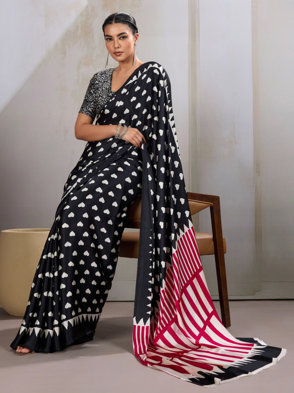 Pure Ajrakh modal satin fabric featuring traditional printed motifs with rich, earthy tones and a soft, breathable feel, perfect for all-day elegance.