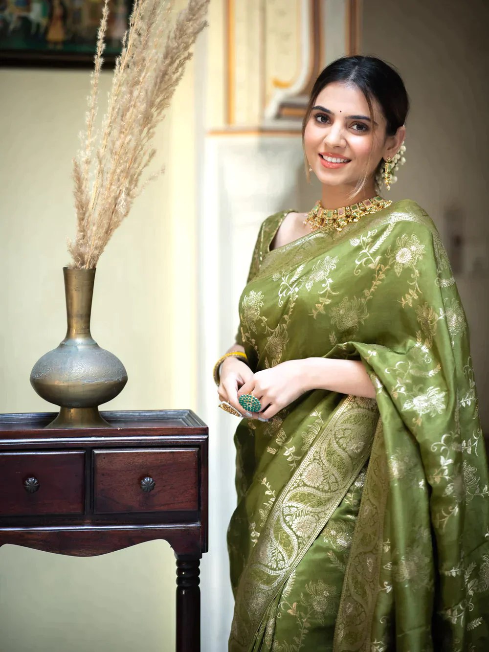 The richly crafted border and opulent pallu showcase traditional Banarasi Silk sarees