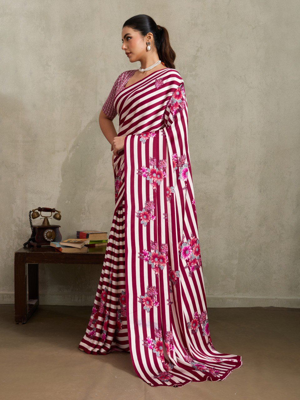 Pure Ajrakh modal satin fabric featuring traditional printed motifs with rich, earthy tones and a soft, breathable feel, perfect for all-day elegance.