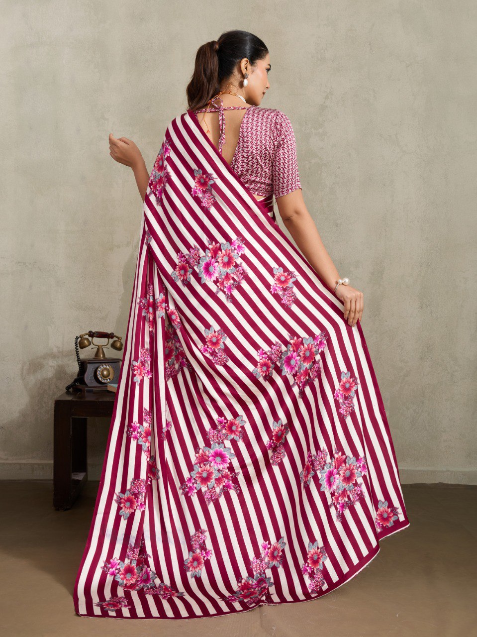Pure Ajrakh modal satin fabric featuring traditional printed motifs with rich, earthy tones and a soft, breathable feel, perfect for all-day elegance.