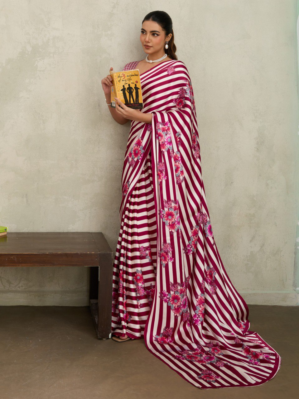 Pure Ajrakh modal satin fabric featuring traditional printed motifs with rich, earthy tones and a soft, breathable feel, perfect for all-day elegance.