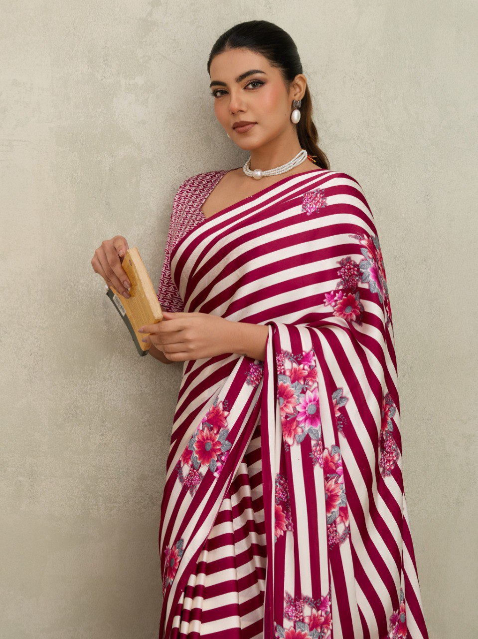 Pure Ajrakh modal satin fabric featuring traditional printed motifs with rich, earthy tones and a soft, breathable feel, perfect for all-day elegance.