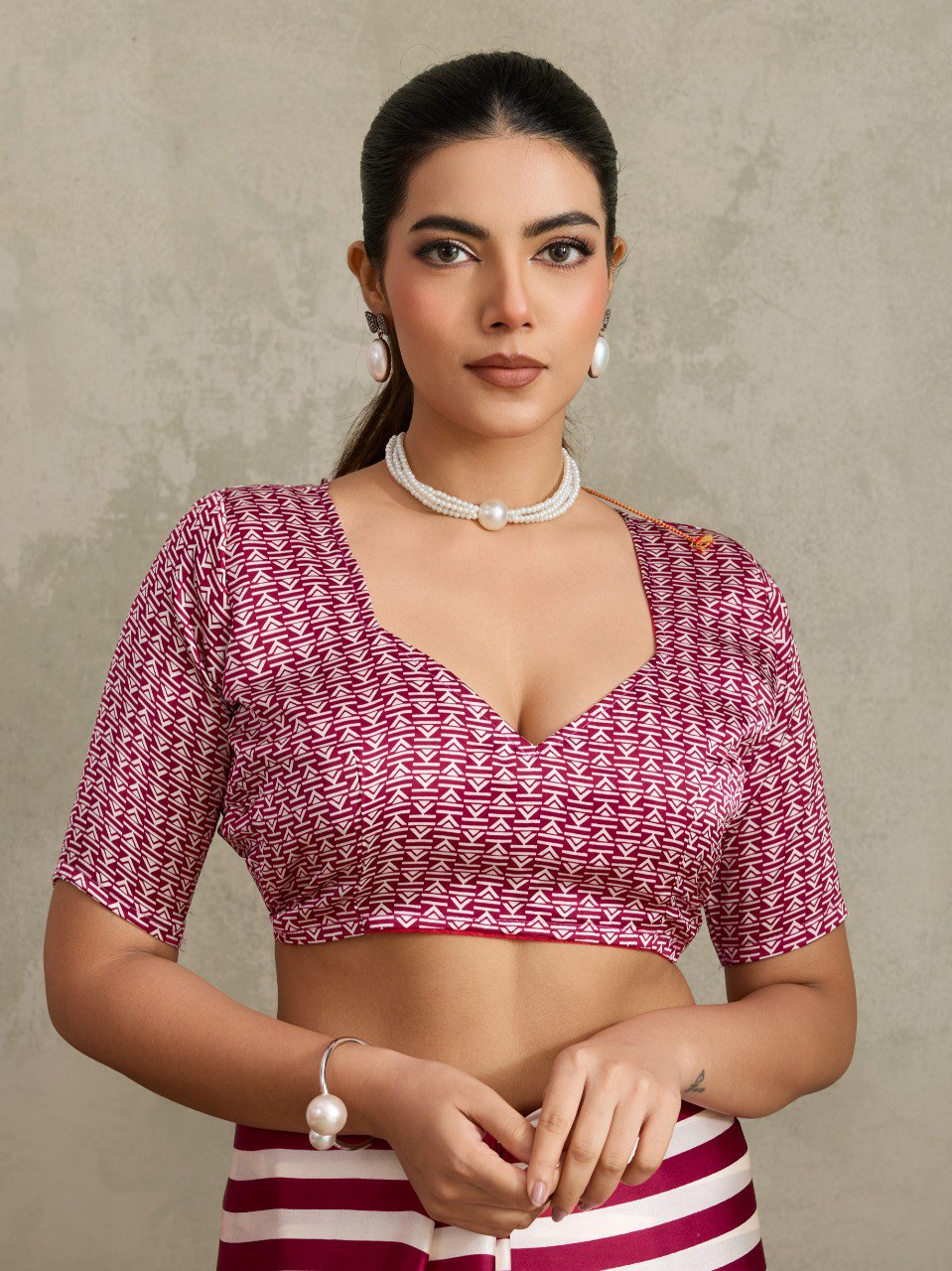 Pure Ajrakh modal satin fabric featuring traditional printed motifs with rich, earthy tones and a soft, breathable feel, perfect for all-day elegance.