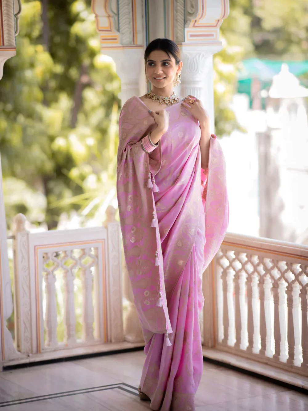 The richly crafted border and opulent pallu showcase traditional Banarasi Silk sarees