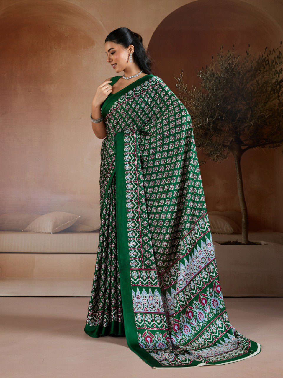 Pure Ajrakh modal satin fabric featuring traditional printed motifs with rich, earthy tones and a soft, breathable feel, perfect for all-day elegance.