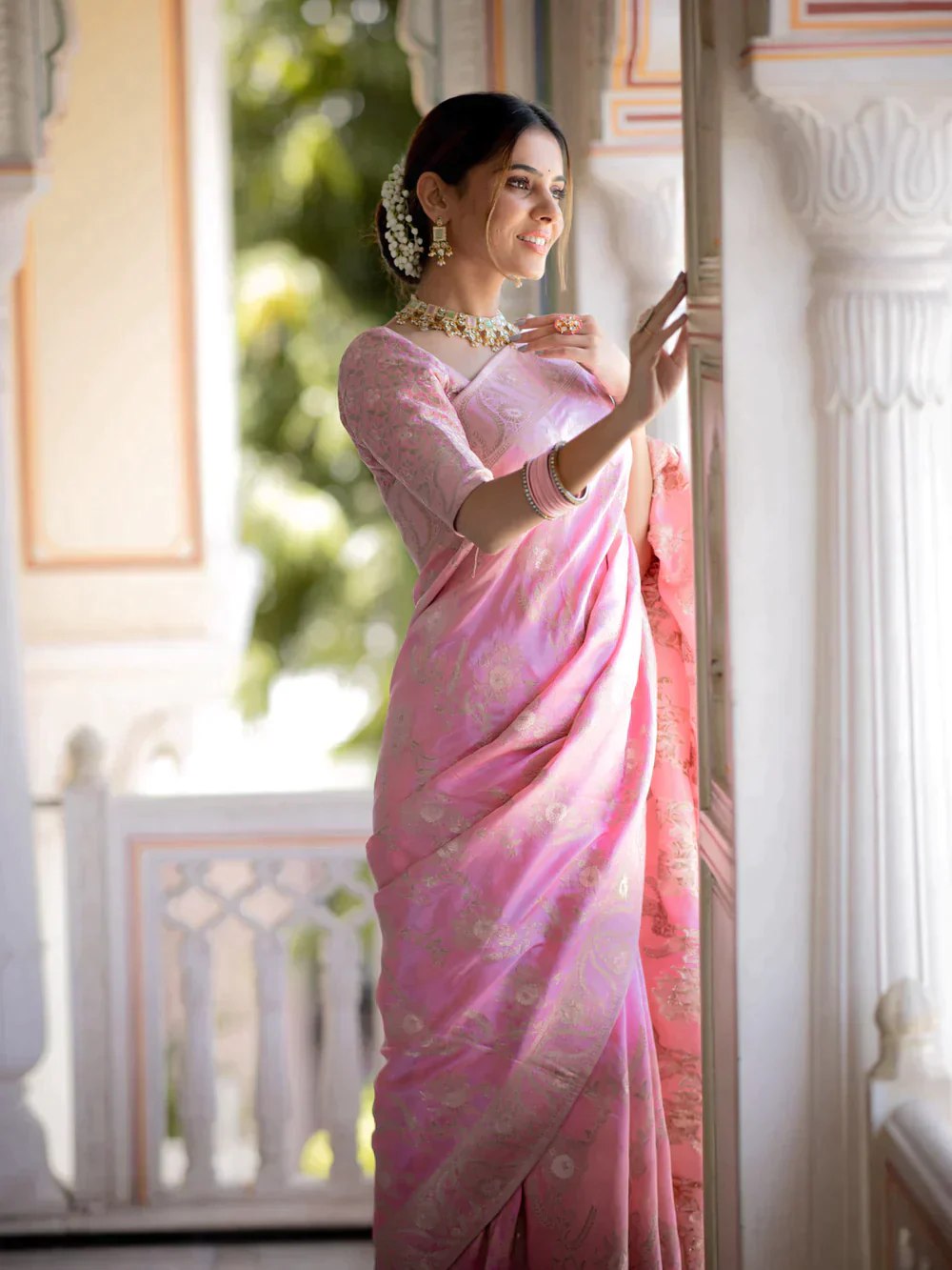 The richly crafted border and opulent pallu showcase traditional Banarasi Silk sarees
