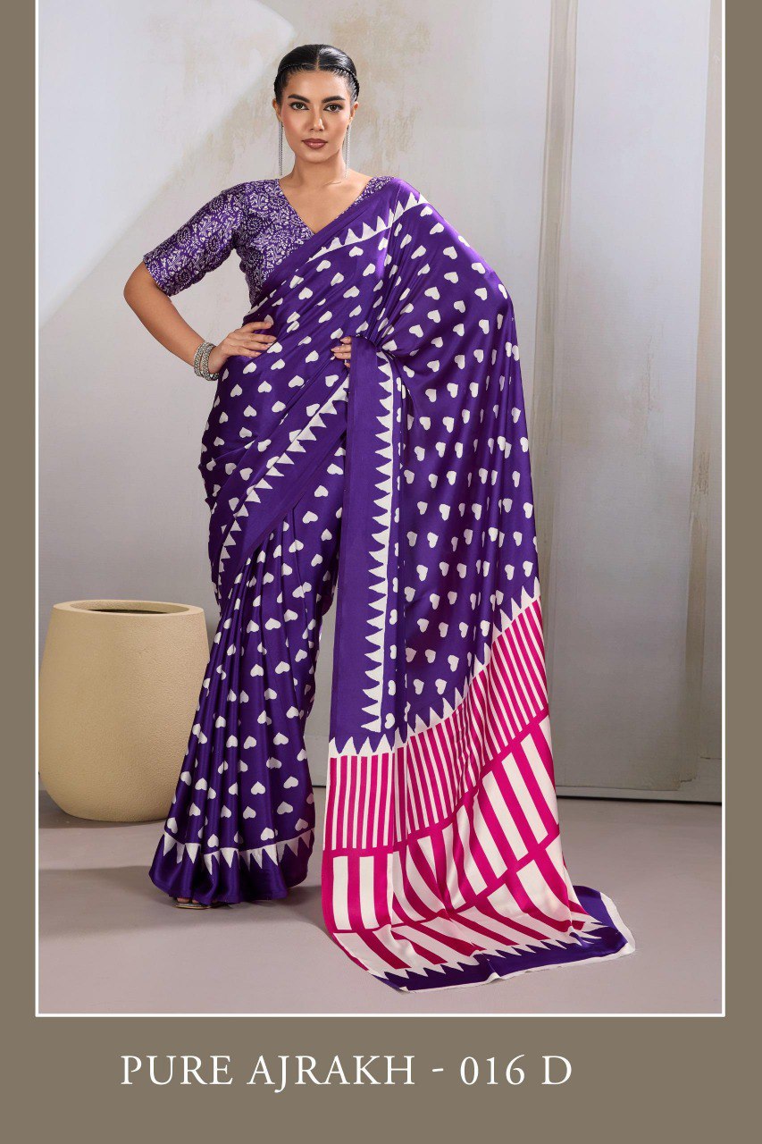 Pure Ajrakh modal satin fabric featuring traditional printed motifs with rich, earthy tones and a soft, breathable feel, perfect for all-day elegance.