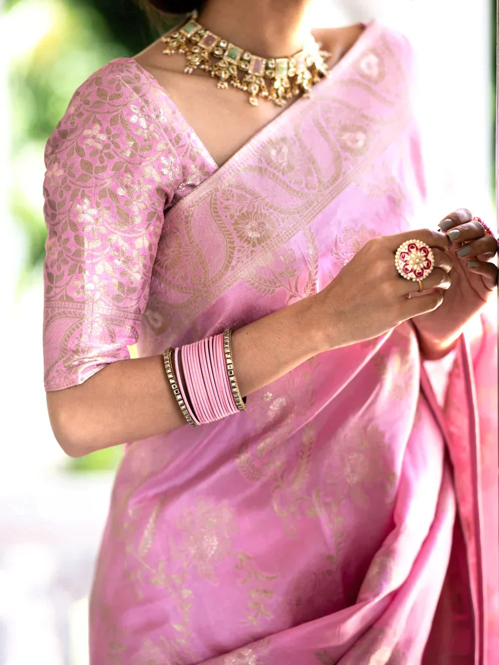 The richly crafted border and opulent pallu showcase traditional Banarasi Silk sarees