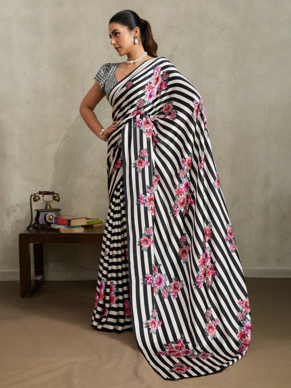 Pure Ajrakh modal satin fabric featuring traditional printed motifs with rich, earthy tones and a soft, breathable feel, perfect for all-day elegance.