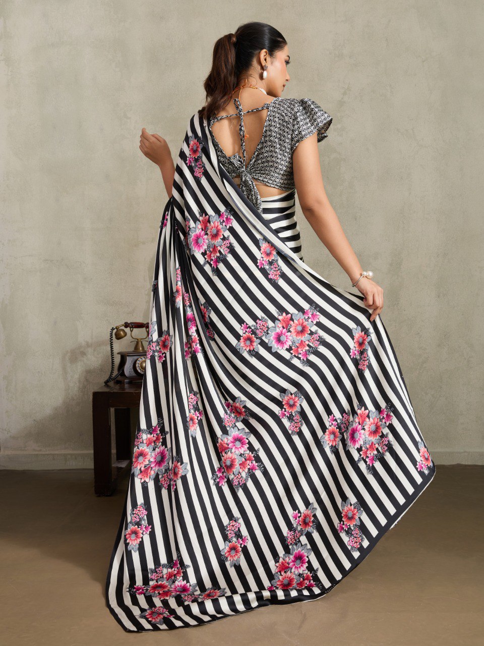 Pure Ajrakh modal satin fabric featuring traditional printed motifs with rich, earthy tones and a soft, breathable feel, perfect for all-day elegance.