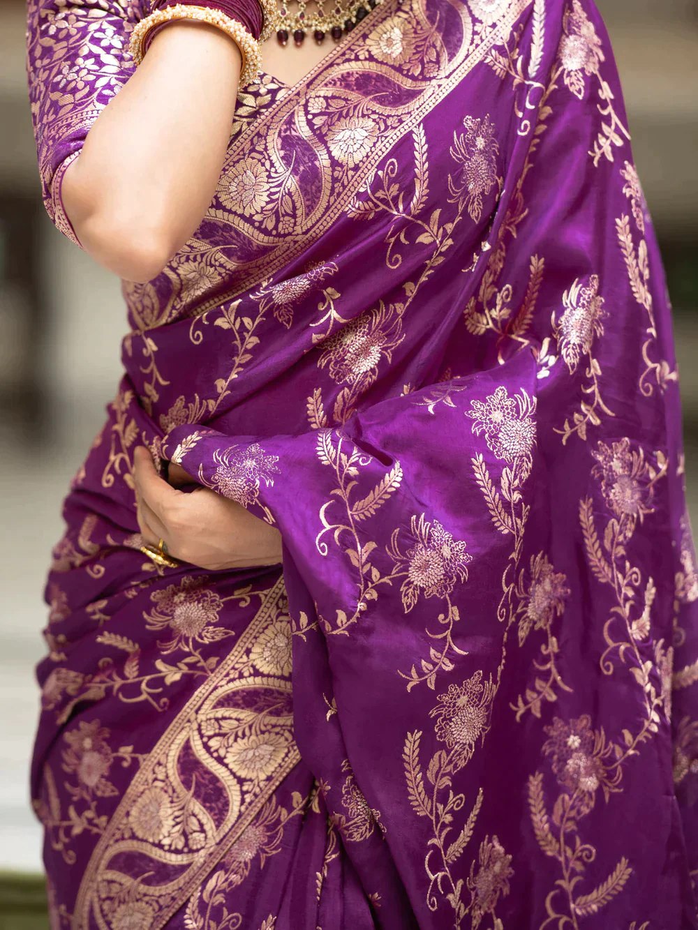 The richly crafted border and opulent pallu showcase traditional Banarasi Silk sarees