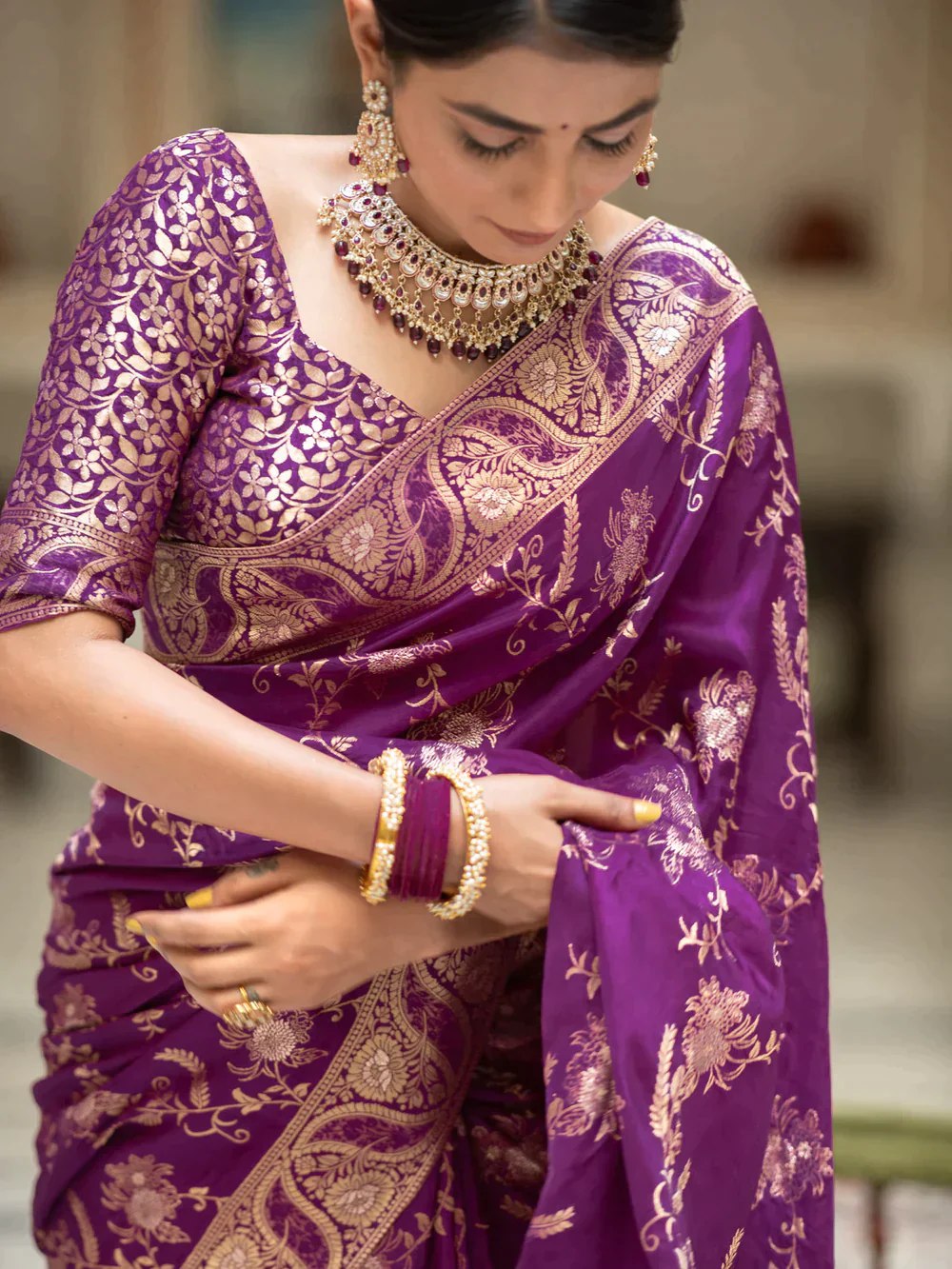 The richly crafted border and opulent pallu showcase traditional Banarasi Silk sarees