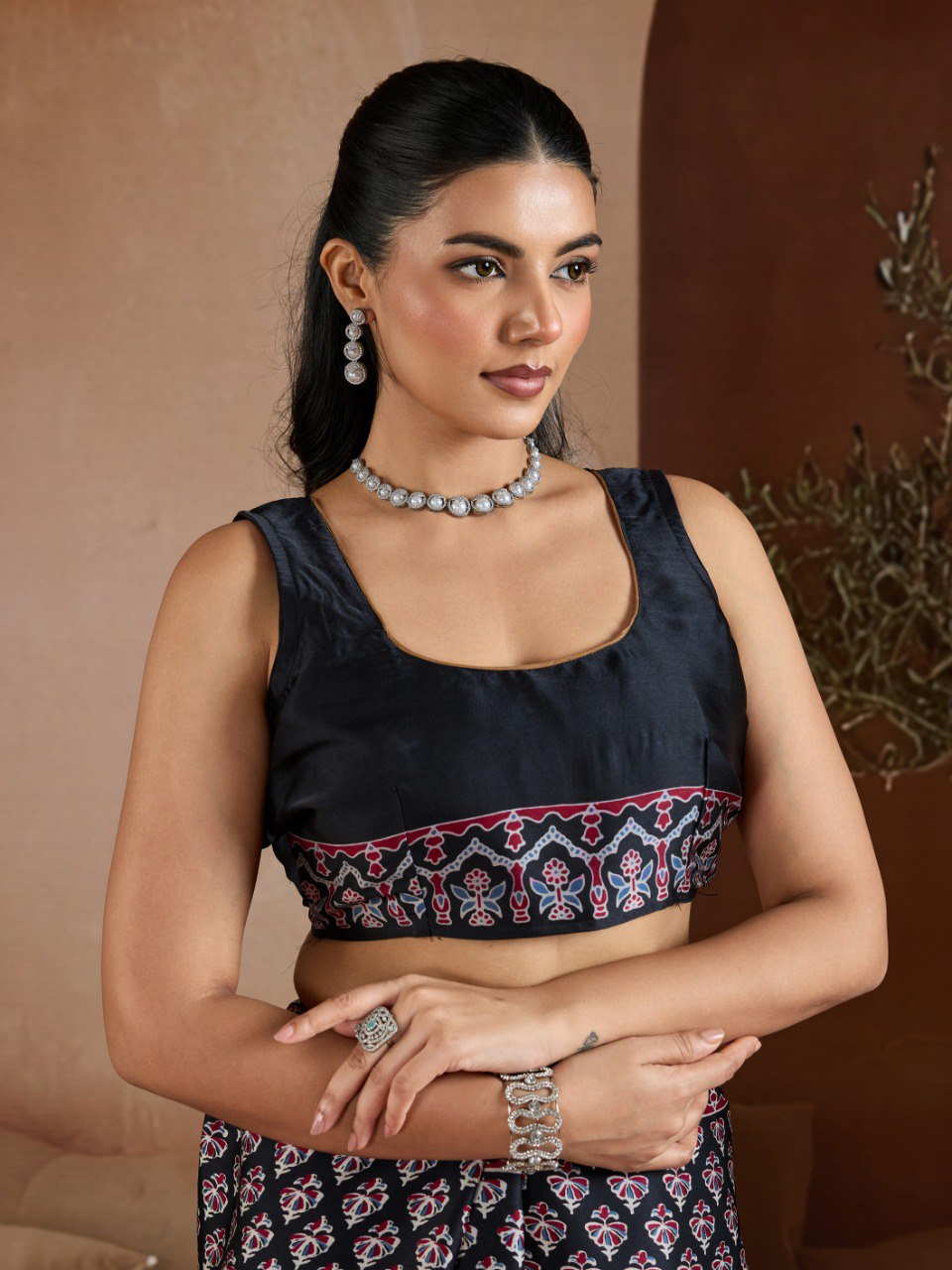 Pure Ajrakh modal satin fabric featuring traditional printed motifs with rich, earthy tones and a soft, breathable feel, perfect for all-day elegance.