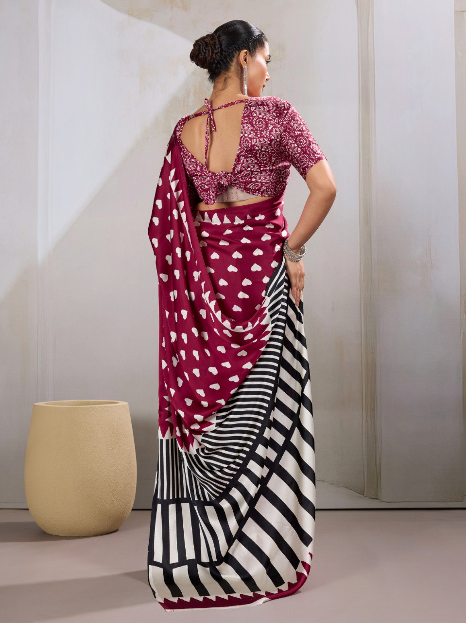 Pure Ajrakh modal satin fabric featuring traditional printed motifs with rich, earthy tones and a soft, breathable feel, perfect for all-day elegance.