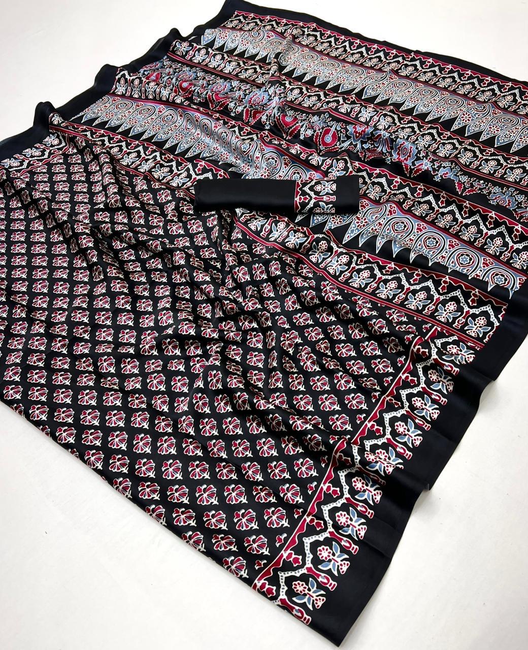 Pure Ajrakh modal satin fabric featuring traditional printed motifs with rich, earthy tones and a soft, breathable feel, perfect for all-day elegance.