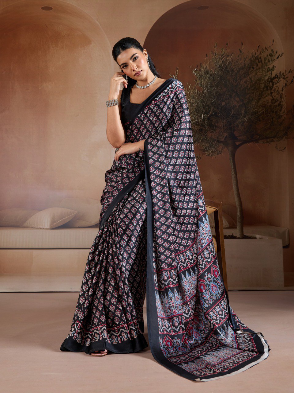 Pure Ajrakh modal satin fabric featuring traditional printed motifs with rich, earthy tones and a soft, breathable feel, perfect for all-day elegance.