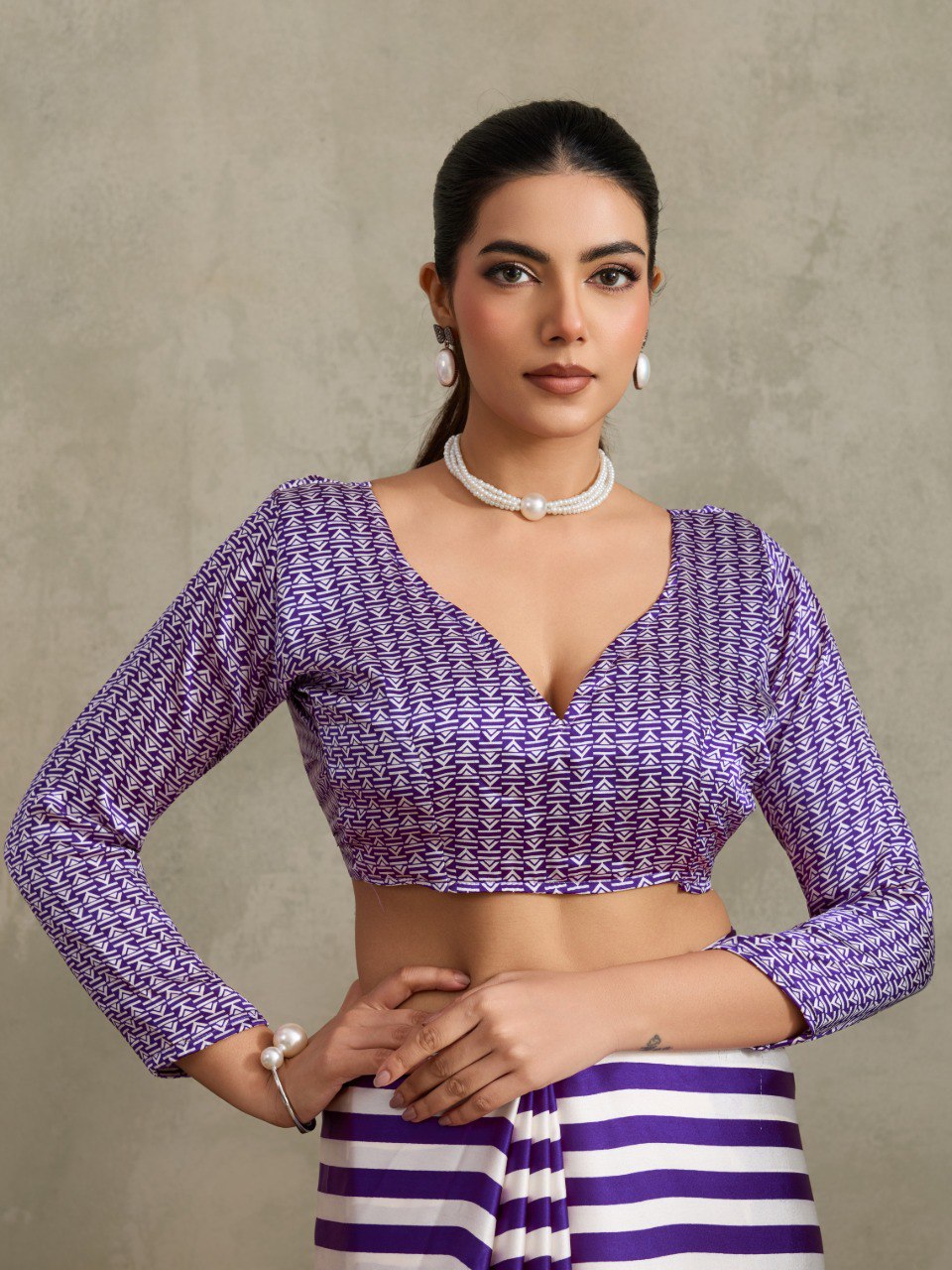 Pure Ajrakh modal satin fabric featuring traditional printed motifs with rich, earthy tones and a soft, breathable feel, perfect for all-day elegance.