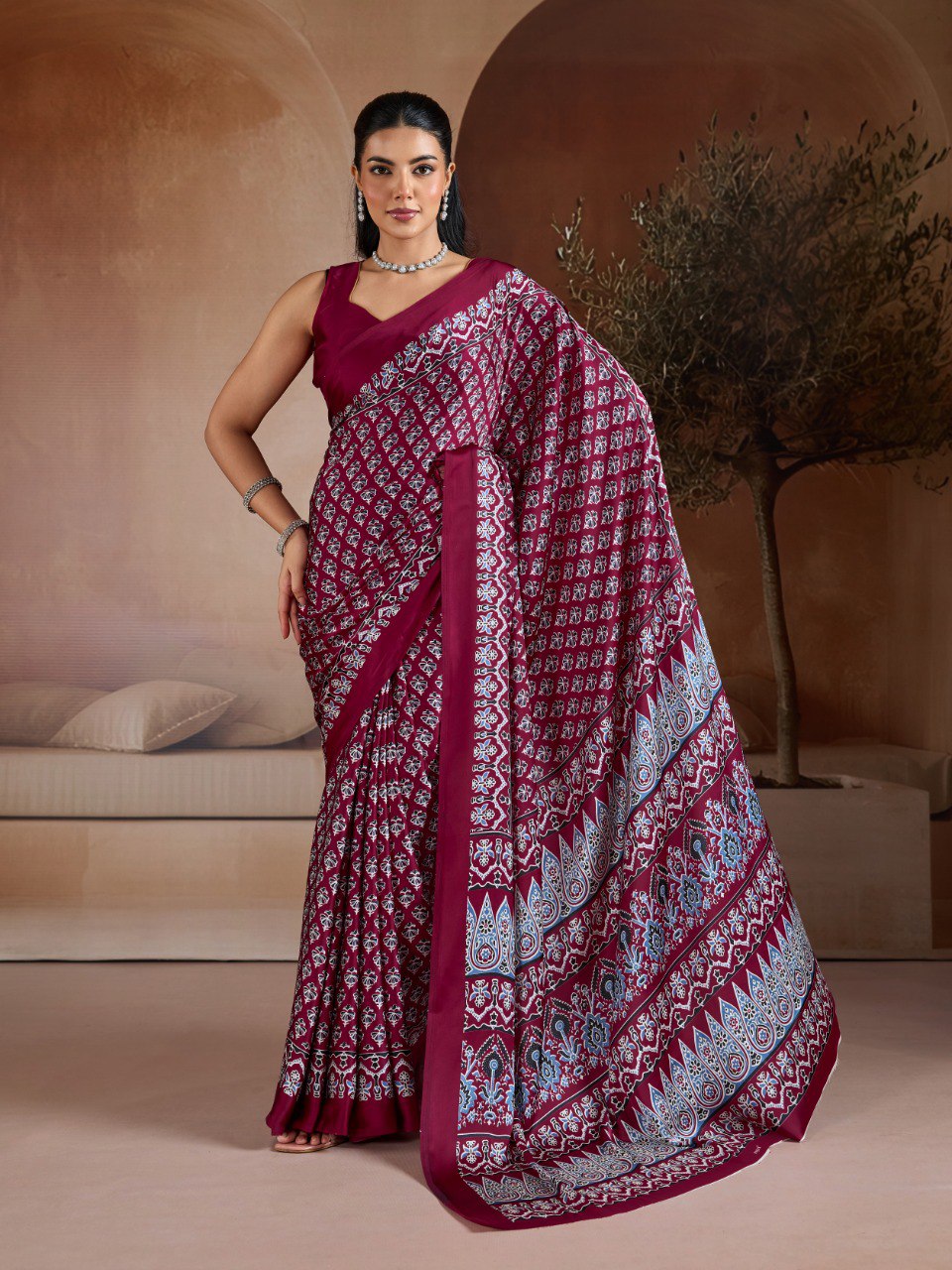 Pure Ajrakh modal satin fabric featuring traditional printed motifs with rich, earthy tones and a soft, breathable feel, perfect for all-day elegance.