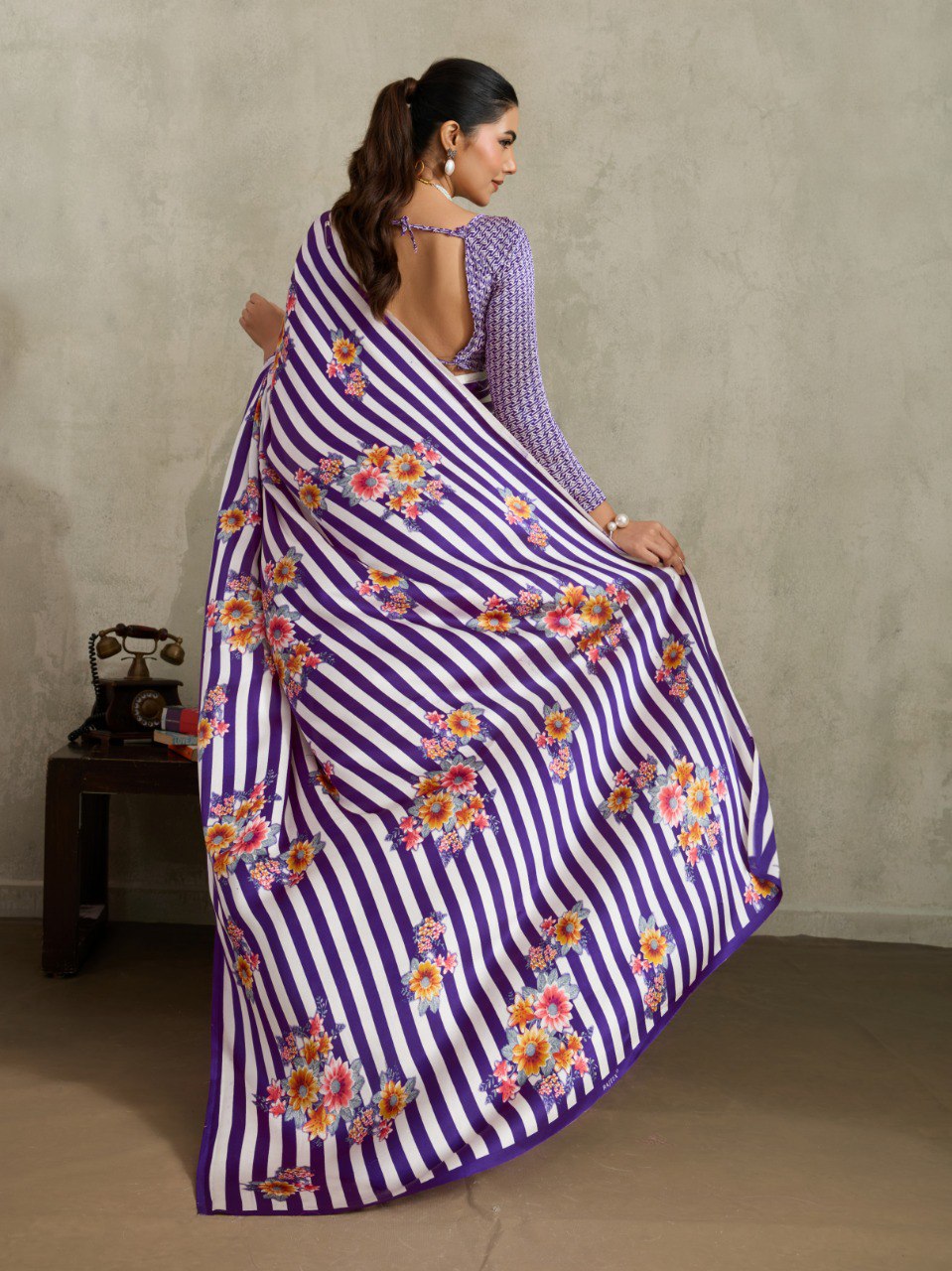 Pure Ajrakh modal satin fabric featuring traditional printed motifs with rich, earthy tones and a soft, breathable feel, perfect for all-day elegance.