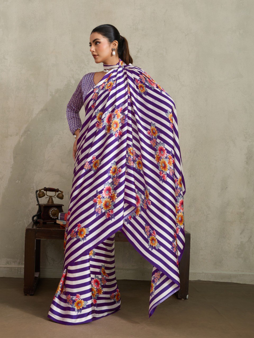 Pure Ajrakh modal satin fabric featuring traditional printed motifs with rich, earthy tones and a soft, breathable feel, perfect for all-day elegance.