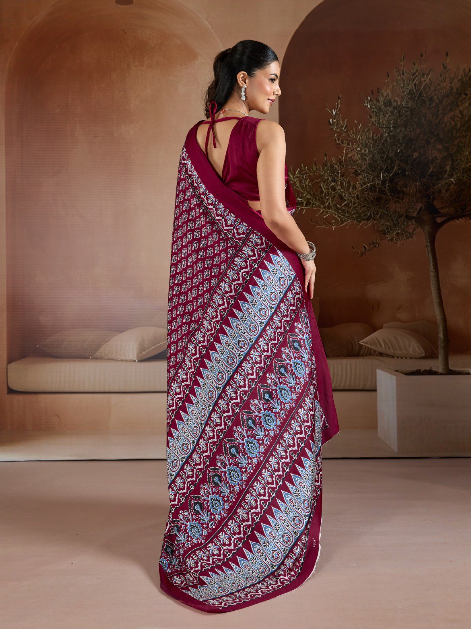 Pure Ajrakh modal satin fabric featuring traditional printed motifs with rich, earthy tones and a soft, breathable feel, perfect for all-day elegance.