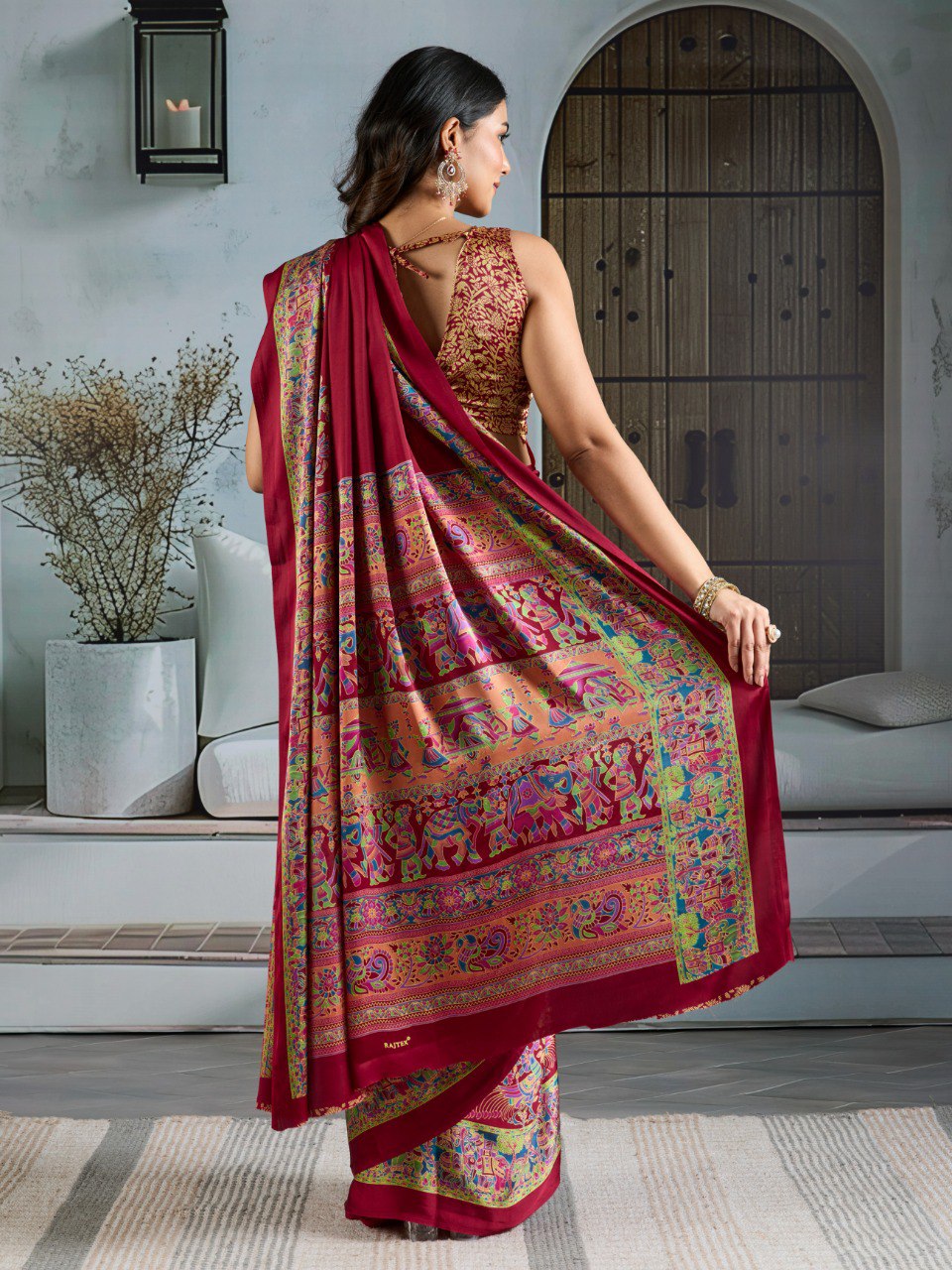 Pure Ajrakh modal satin fabric featuring traditional printed motifs with rich, earthy tones and a soft, breathable feel, perfect for all-day elegance.