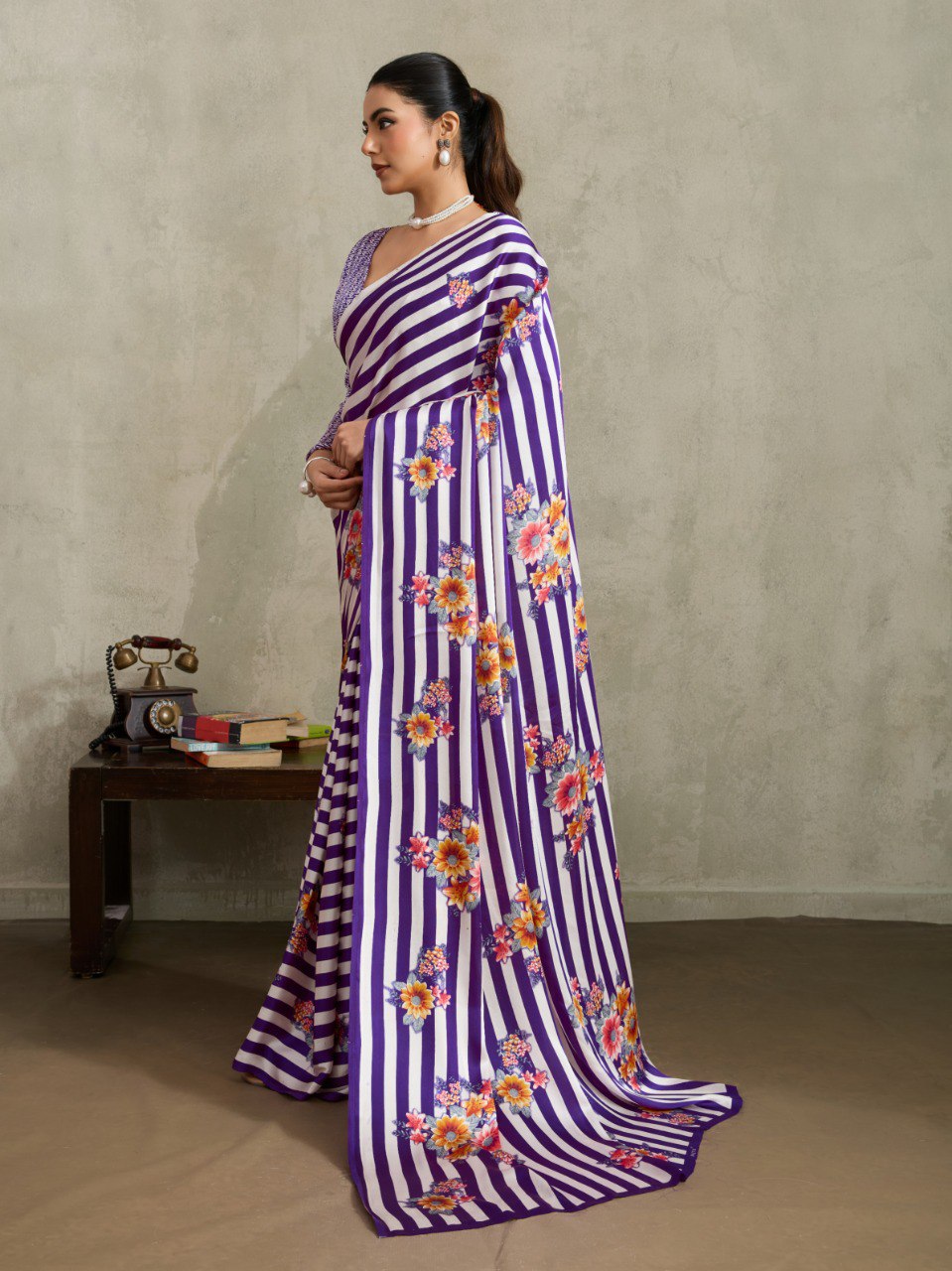 Pure Ajrakh modal satin fabric featuring traditional printed motifs with rich, earthy tones and a soft, breathable feel, perfect for all-day elegance.