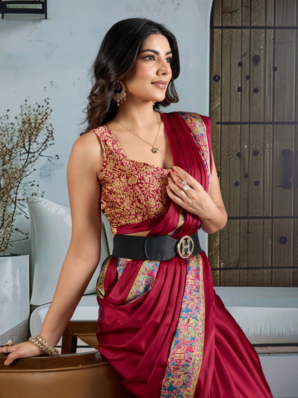 Pure Ajrakh modal satin fabric featuring traditional printed motifs with rich, earthy tones and a soft, breathable feel, perfect for all-day elegance.