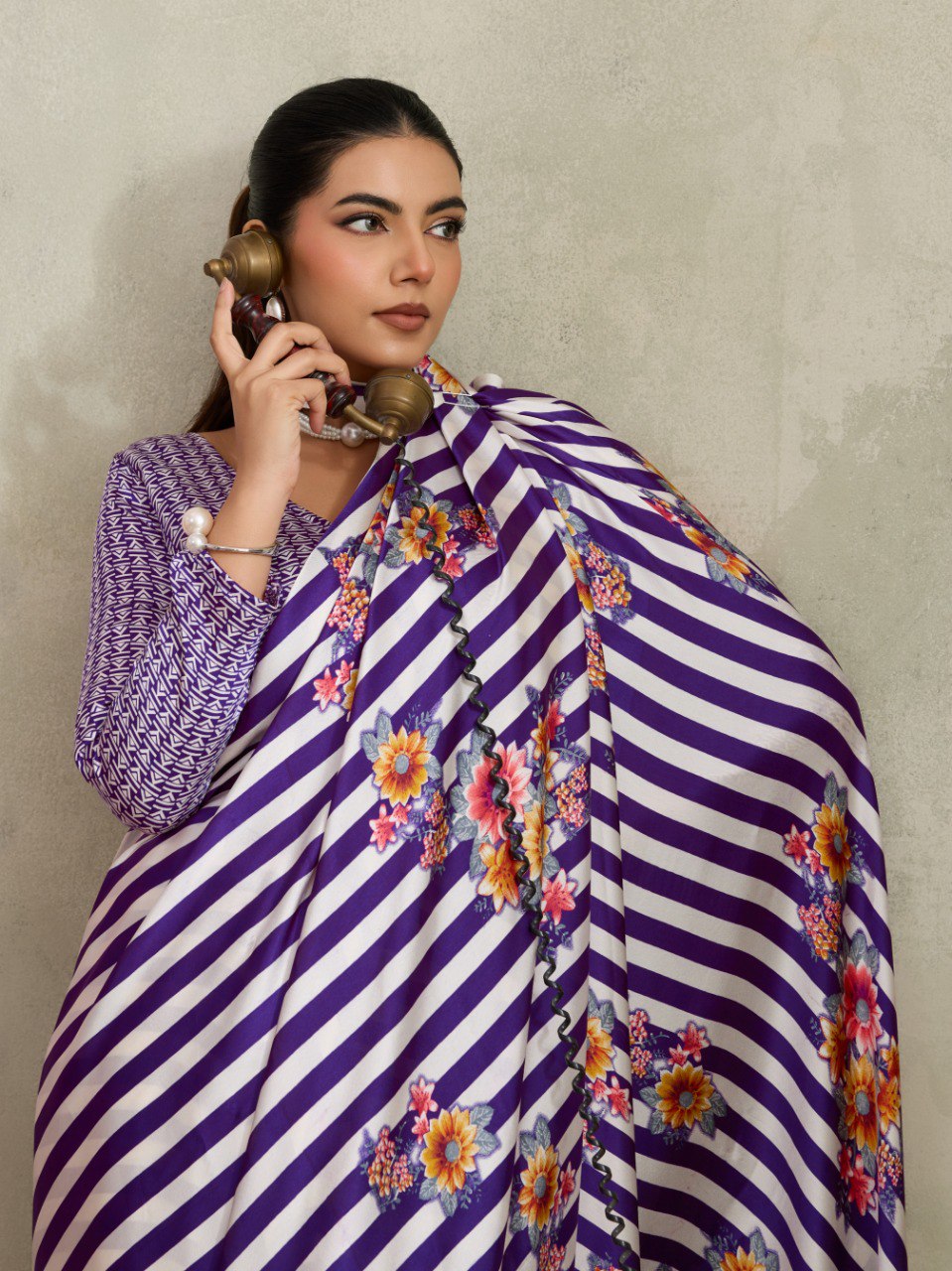 Pure Ajrakh modal satin fabric featuring traditional printed motifs with rich, earthy tones and a soft, breathable feel, perfect for all-day elegance.