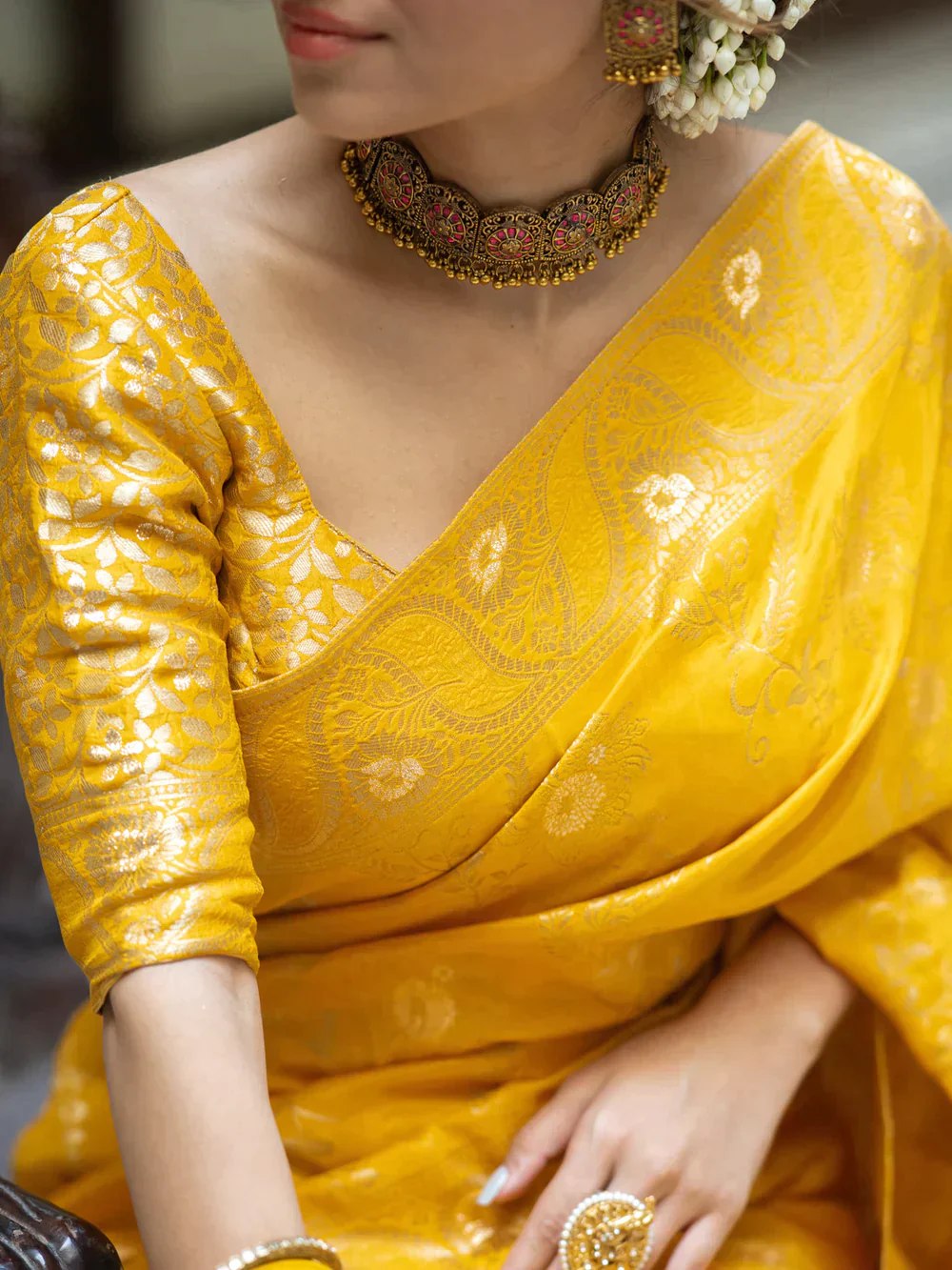 The richly crafted border and opulent pallu showcase traditional Banarasi Silk sarees