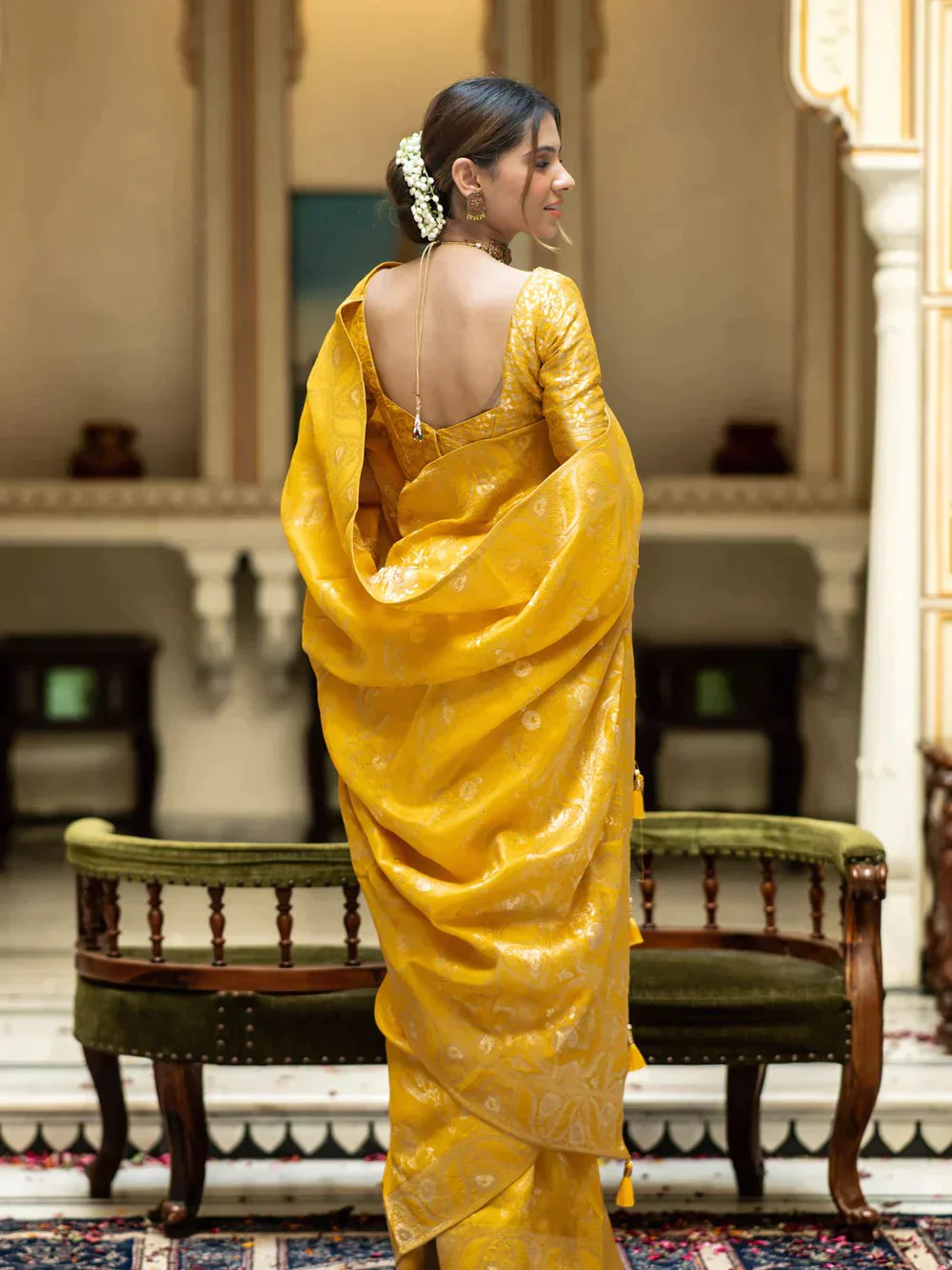 The richly crafted border and opulent pallu showcase traditional Banarasi Silk sarees