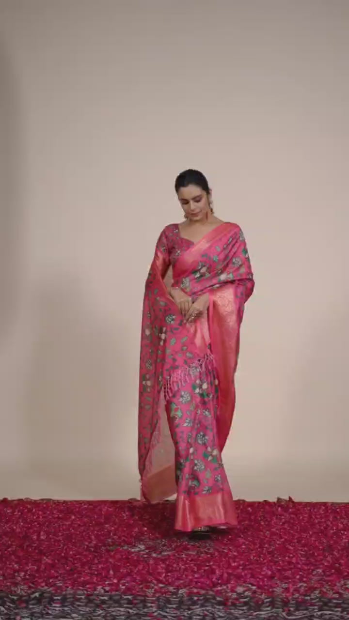 oft Lichi Silk Saree enriched with vibrant floral digital prints and a beautifully woven zari border.